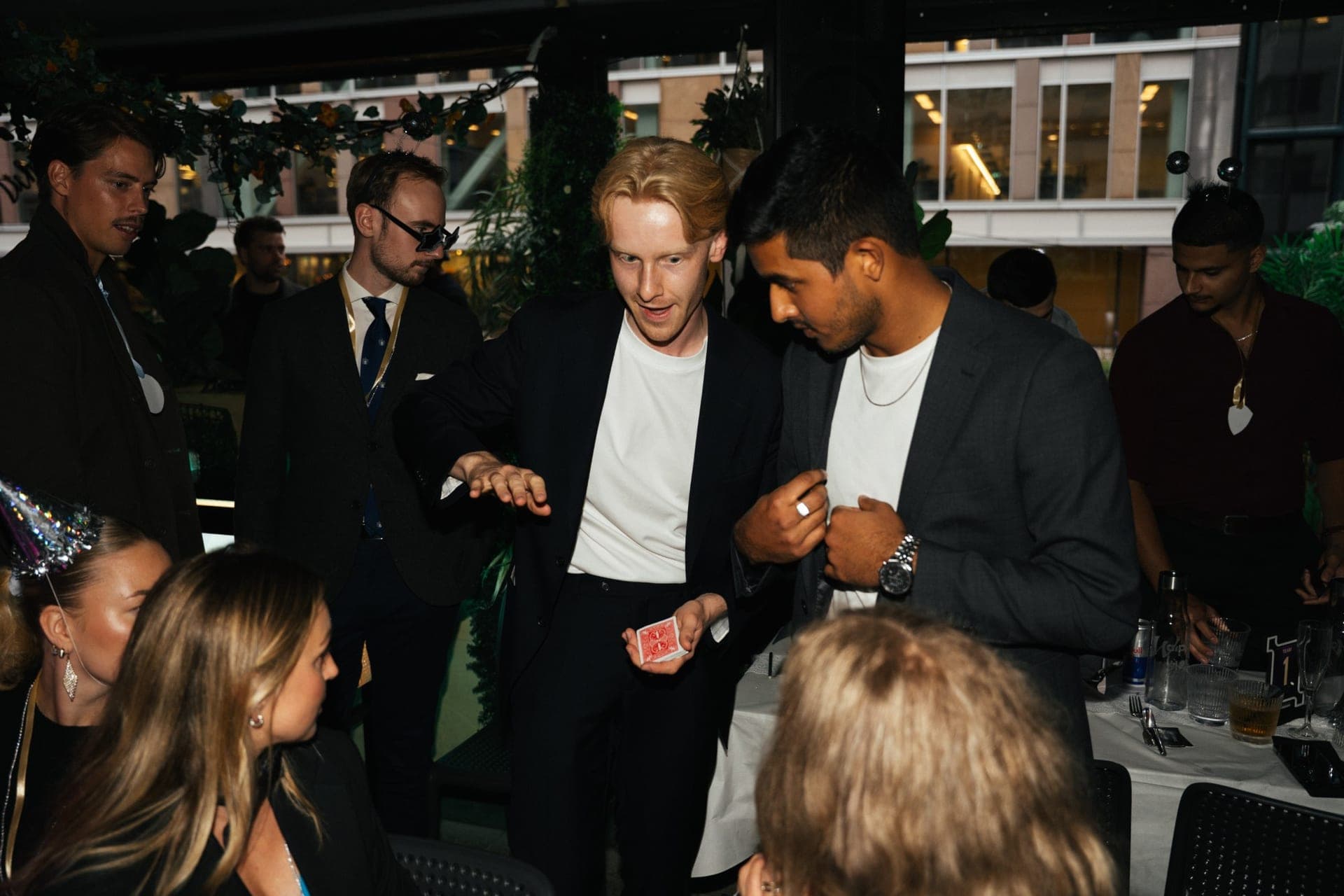 Magician performing a card trick for guests at Auto1's kick-off